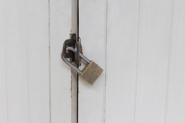 Old padlock on a white wooden door , Old White retro Door with Padlock, locked door,door with master key