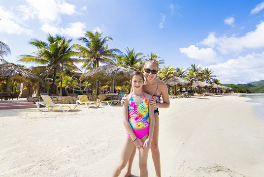 Mother and Daughter enjoying a tropical beach vacation on a beautiful island