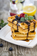 Delicious waffle with berries and chocolate