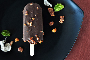 Close up Chocolate Ice Cream Bar on Black Plate