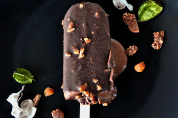 Melting Chocolate Ice Cream on Black Plate
