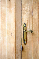 door handle vintage  lock, wood background