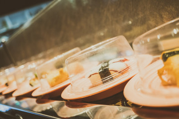 Sushi tray on conveyor belt