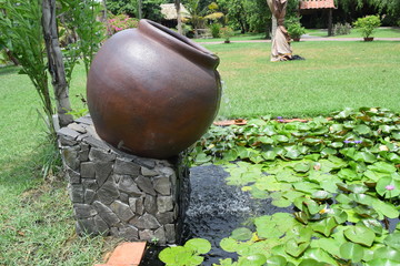 landscaping garden with pottery jar