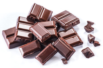 Pieces of chocolate bar isolated on a white background.