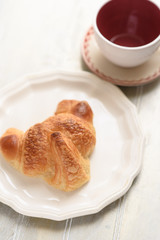 Croissant and coffee cup