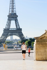 Woman run at tour Eiffel