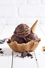 Chocolate ice cream bowl and chocolate pieces. - 121624853