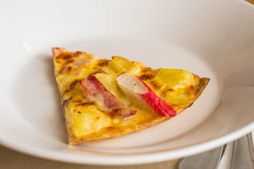 Small dish pizza on table in a restaurant.