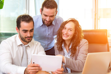 Group of business associates working together at the office