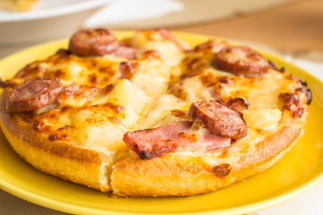 Small dish pizza on table in a restaurant.