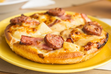 Small dish pizza on table in a restaurant.