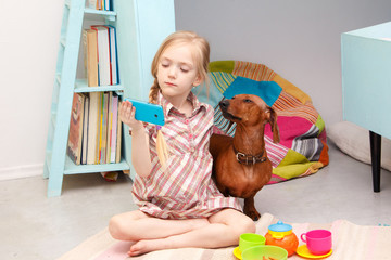The little girl at the picnic with the dog