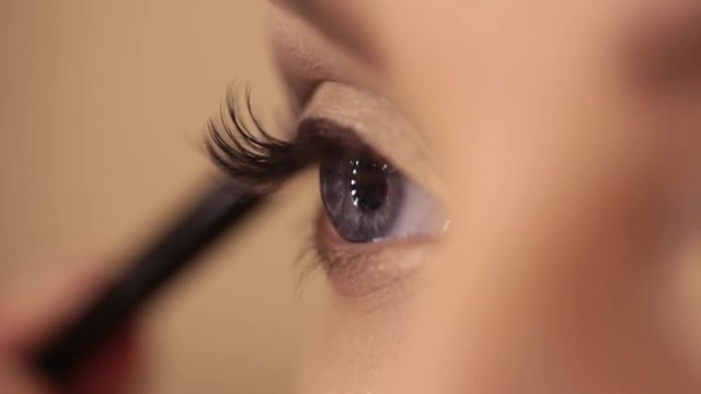 Process of applying eyeshadow, eye make up, backstage
