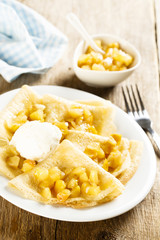 Pancakes with apple sauce and ice cream