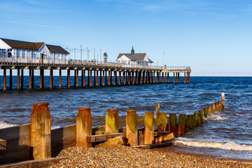 Obraz premium Wooden Groynes and Pier at Southwold Beach, UK