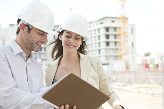 Engineers working together at construction site