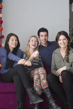 Friends watching movie at home together