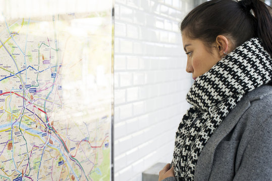 Woman looking at public transit map