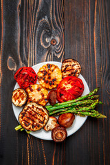 grilled vegetables on wooden table