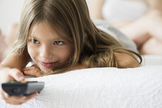 Little girl holding remote control