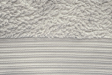 хлопковое махровое полотенце текстура. серая бежевая махровая ткань кайма