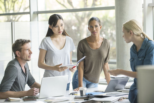 Office workers collaborating on group project