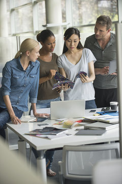 Office workers collaborating on project