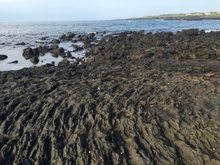 Basalt beach on the Jeju island in Korea