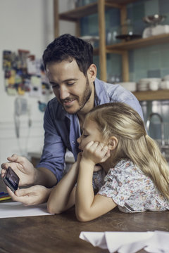 Father and daughter spending time at home together