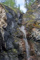 Fototapeta na wymiar Waterfall in the jungle of the Dominican Republic. Samana Peninsula. photo toned.