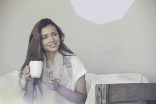 Woman enjoying solitude with cup of tea