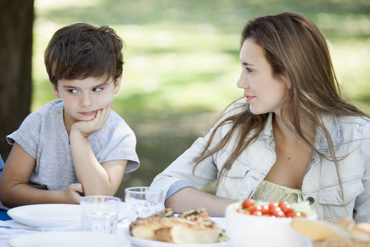 Mother disciplining disobedient child