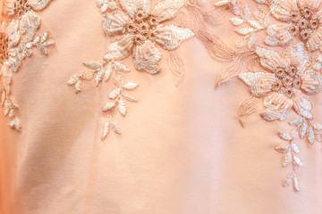 Beautiful lace with flower pattern - macro photo on wedding dres