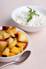 Photo of curd dessert with peaches and mint leaf
