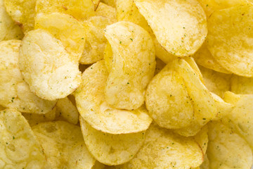 Close up potato chips on top view background.