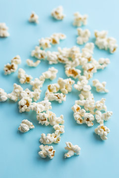 Popcorn on blue background.