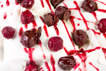Delicious ice-cream with berries and cherry syrop.