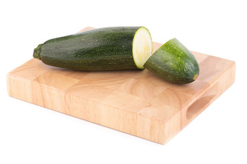 green zucchini vegetables isolated on white