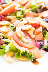 Tomato and vegetable salad with smoked salmon meat