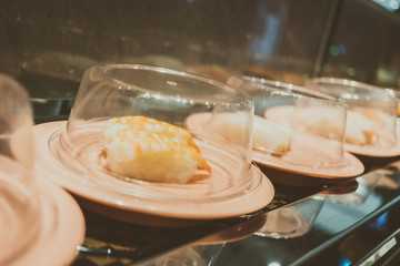 Sushi tray on conveyor belt