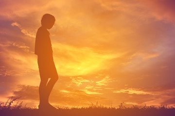 Silhouette alone girl at sky sunset