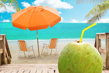 
Chaise lounge, coconut and umbrella on beach