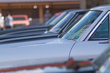 Fototapeta premium A lot of cars standing in a row. Glass with reflection.