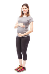 Cute pregnant woman in sporty outfit