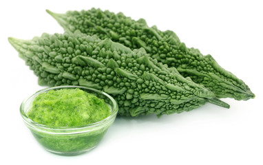 Green momodica with paste in a glass bowl