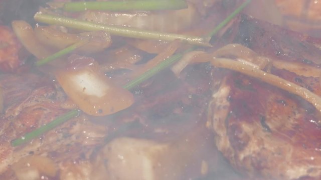 Close up of Pork Meat Steak on Barbecue Grill