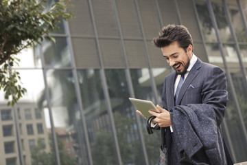 Businessman checking his tablet