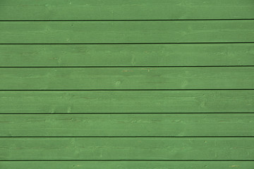 Green painted wood panel.