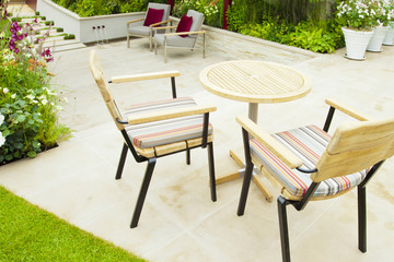 Tranquil garden with a patio and two seats